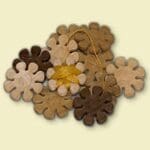 Here's an alt tag for the image: `Brown and tan star-shaped dog treats.`