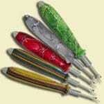 Here's an alt tag for the image: Five colorful crochet hooks displayed.