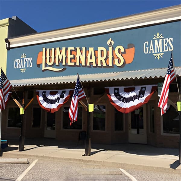 A building with american flags hanging from the front.